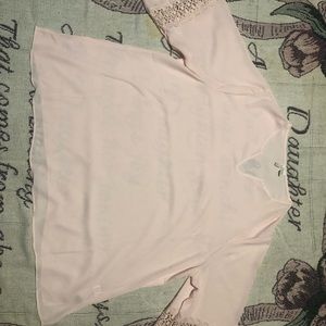 I’m selling a dressy shirt with design on sleeves.